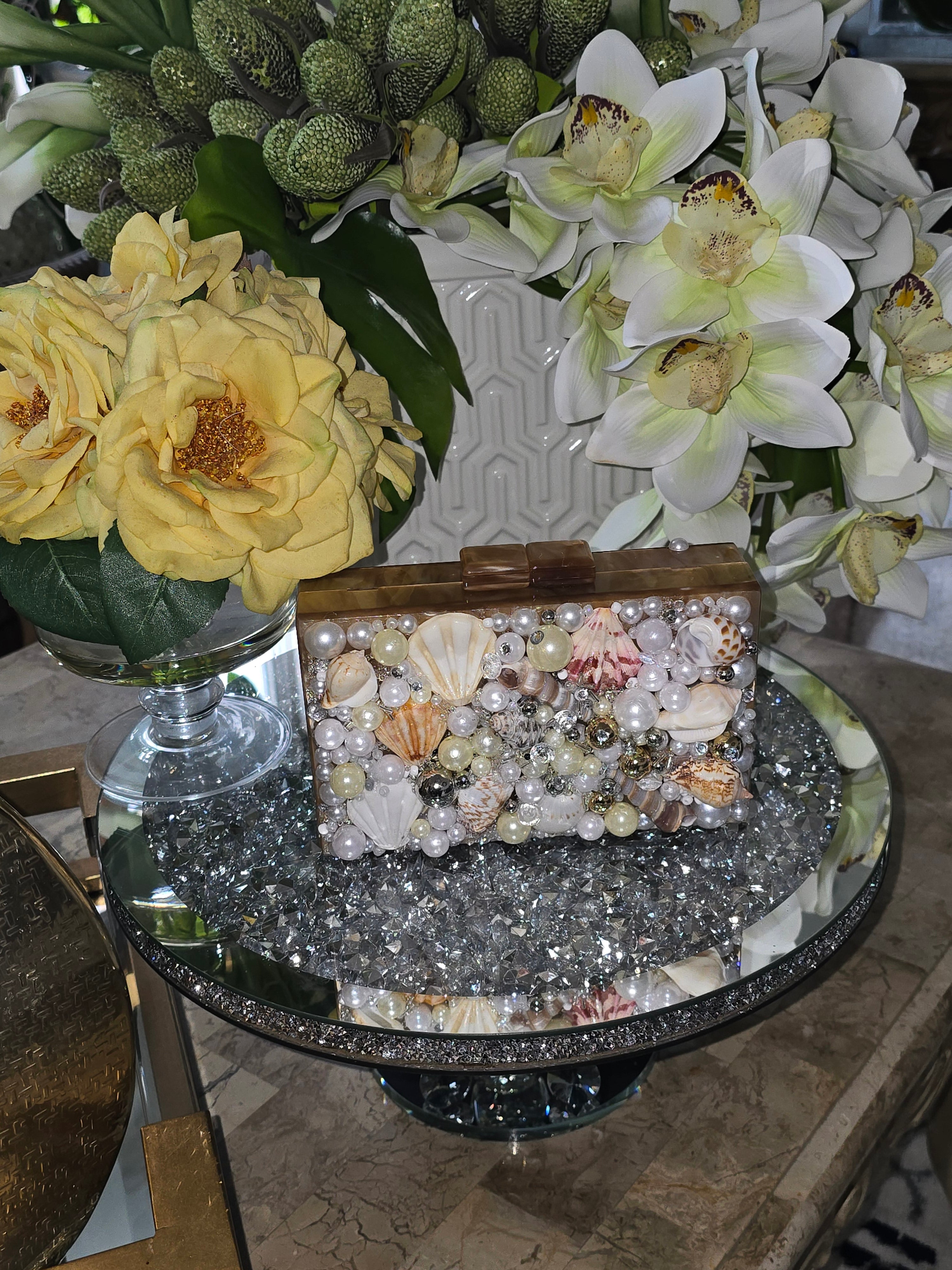 beige seashell clutch